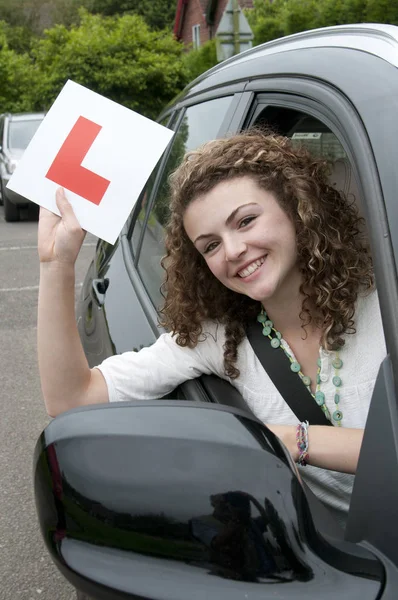 Young Female Driver Holding Learner Plate — Stock Photo, Image