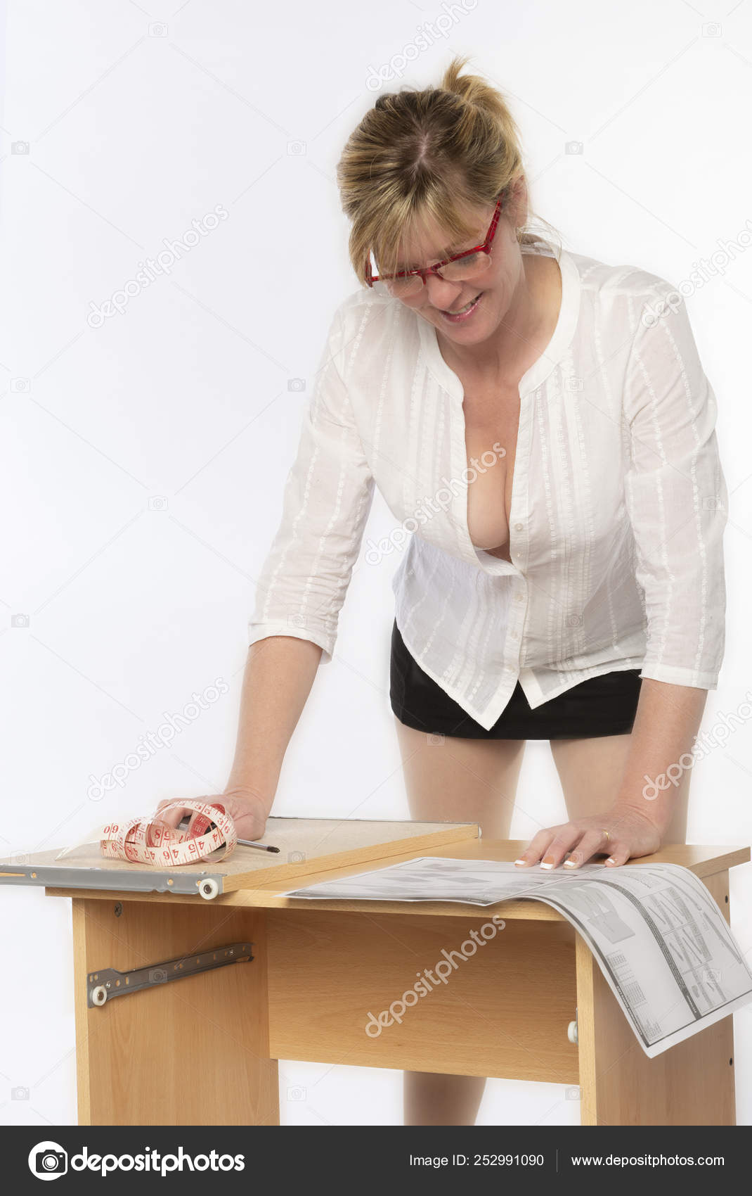 Woman Constructing Personal Computer Desk Flatpack Using
