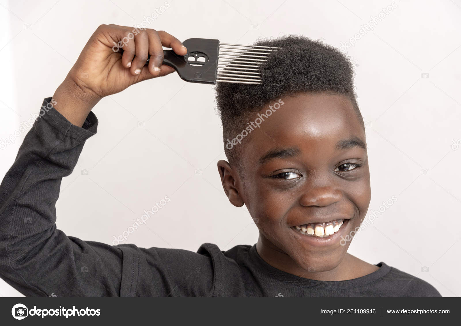 Nine Year Old Boy Curly Hair Holding Wide Tooth Afro Stock Photo by ©petertt 264109946 Nine Year Old Boy Curly Hair Holding Wide Tooth Afro Stock Photo by ©petertt 264109946