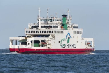 Southampton Water, England, UK. May 2019.  The Green Red Funnel roro ferry outbound to the Isle of Wight. clipart