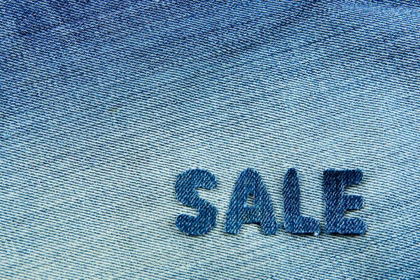 Die Aus Jeans Geschnitzten Buchstaben Verkauf Auf Jeansgrund — Stockfoto