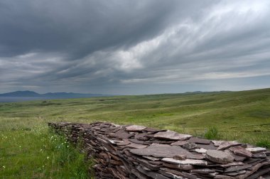 Cloudy sky in the Oglakhty reserve on the banks of the Yenisei River. Khakassia, Russia. clipart