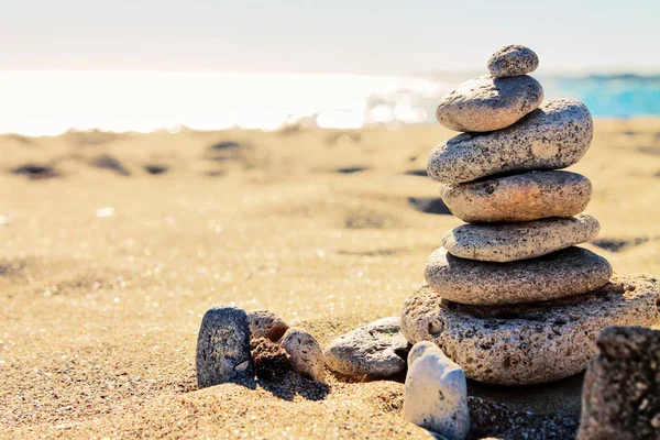 Zen stones, sand, sea