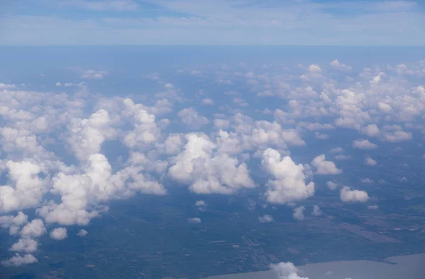 landscape look down from the airplane look see the sky and cloud beautiful