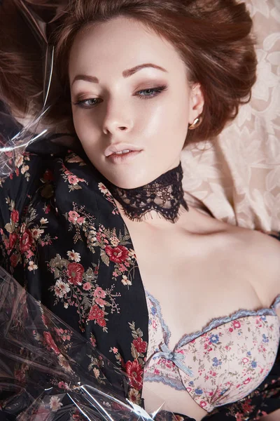 Beautiful Girl Black Dress Flowers Polyethylene Sensual Young Woman Lying — Stock Photo, Image