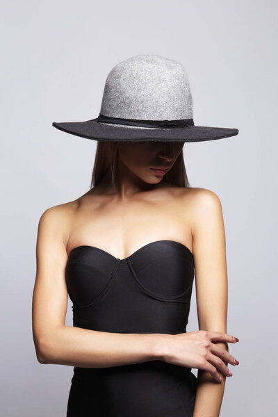 Young woman in hat and bikini. summer fashion girl