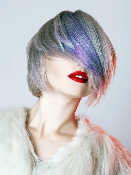 young Woman with colorful Hair, dressed in White Fur. fashion Beauty Model Girl with trendy color hair and red Lips