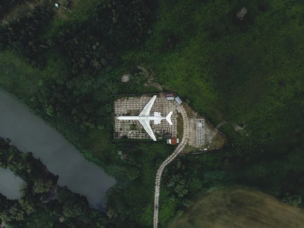The old plane in green field by drone