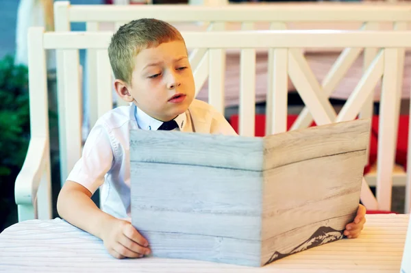 Little Boy Sitting Cafe Child Holding Menu — Stock Photo, Image