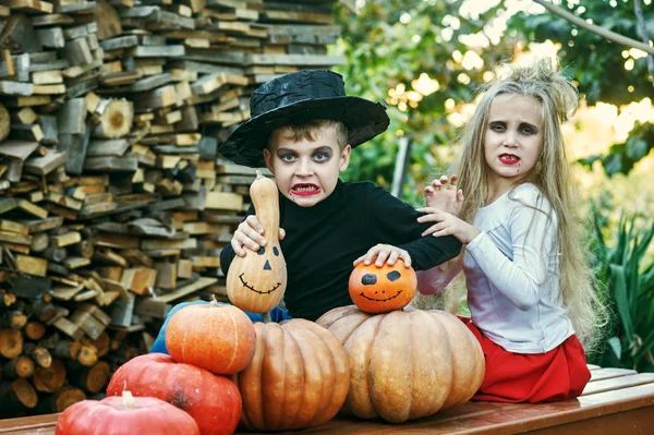 The Holiday Of Halloween! Funny kids in costumes with pumpkins