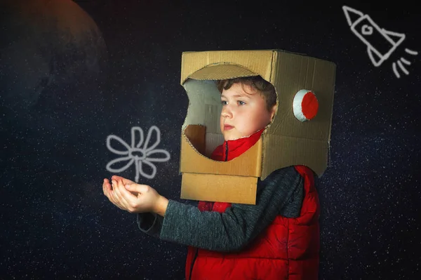 the child is dressed in an astronaut costume, the boy plays space Explorer