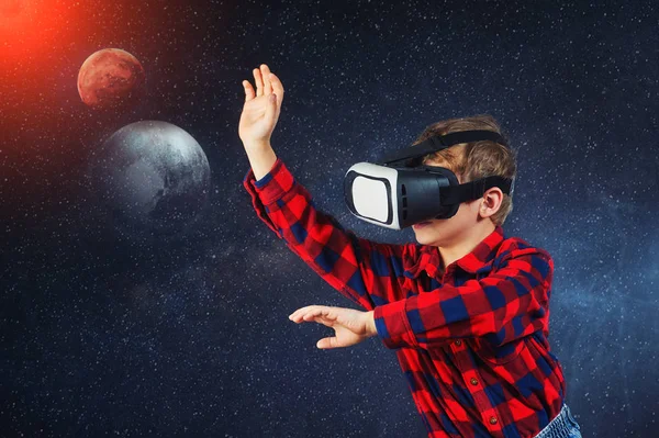Virtual world of technology. A child plays in a virtual reality