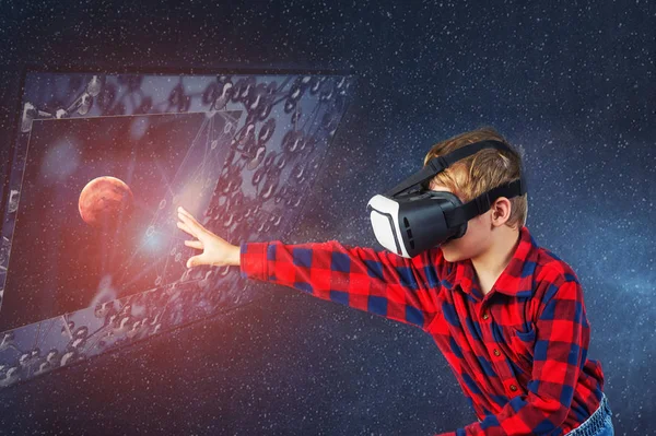 Virtual world of technology. A child plays in a virtual reality