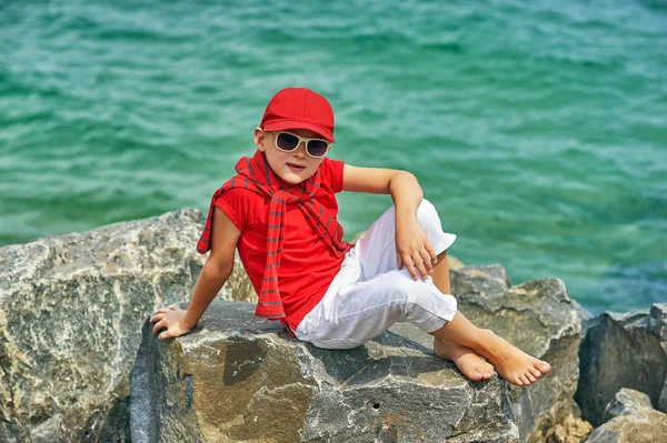 Fashionable Handsome Boy Sea Coast Rest Travel Child Sits Stone — Stock Photo, Image