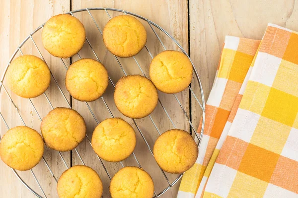 Mini cornbread muffins on cooling tray.