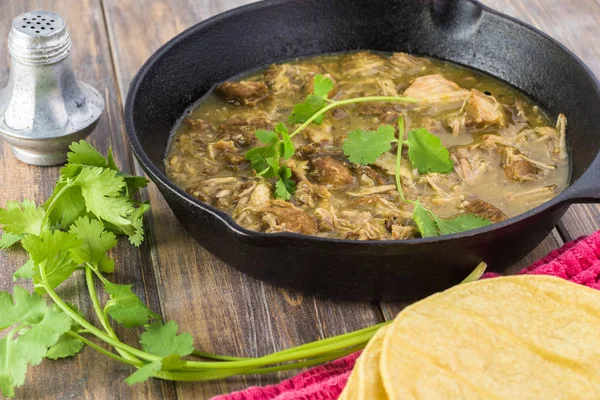 Mexican cuisine. Pork in green sauce. — Stock Photo, Image