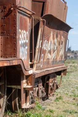 Close-up of Rusted Train Car Side with White Graffiti