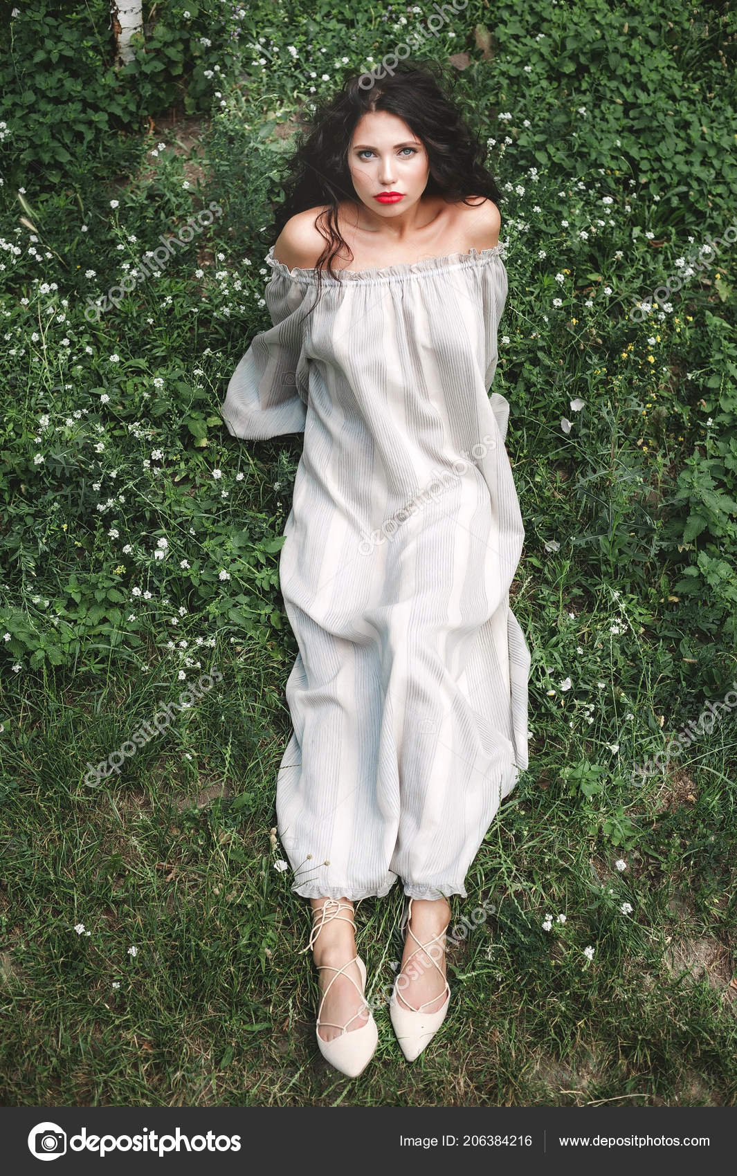 Curly Girl In A Sundress Lies On The Grass With White Flowers Photo By Steineranden Curly Girl In A Sundress Lies On The Grass With White Flowers Photo By Steineranden