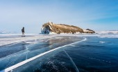 Картина, постер, плакат, фотообои "travelling in winter, a man walking on frozen lake baikal in siberia, russia", артикул 207444740