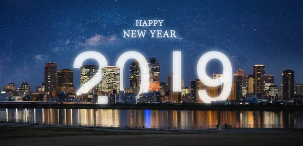 Happy New Year 2019 in the city. Panoramic city at night with starry sky and happy new year 2019 celebration