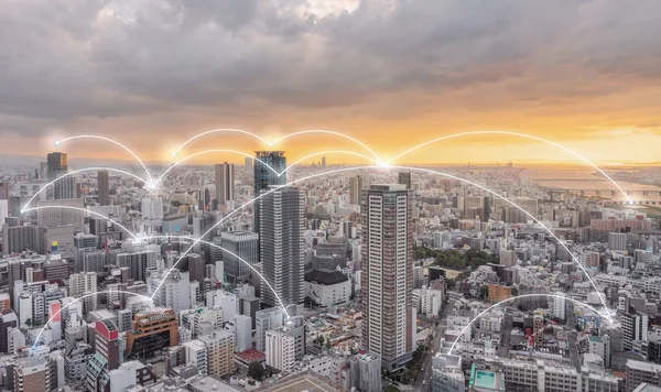 Network connection technology in the city, Osaka city in sunset
