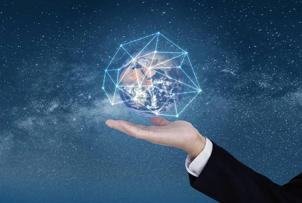 Business networking and blockchain business and technology. Hand holding globe with network connection graphic. Element of this image are furnished by NASA