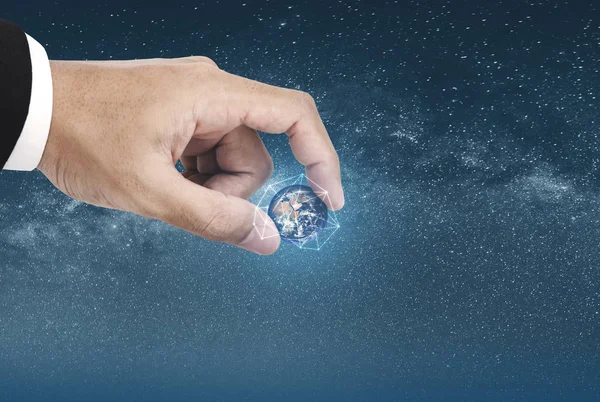 Hand picking globe with network connection graphic. Element of this image are furnished by NASA