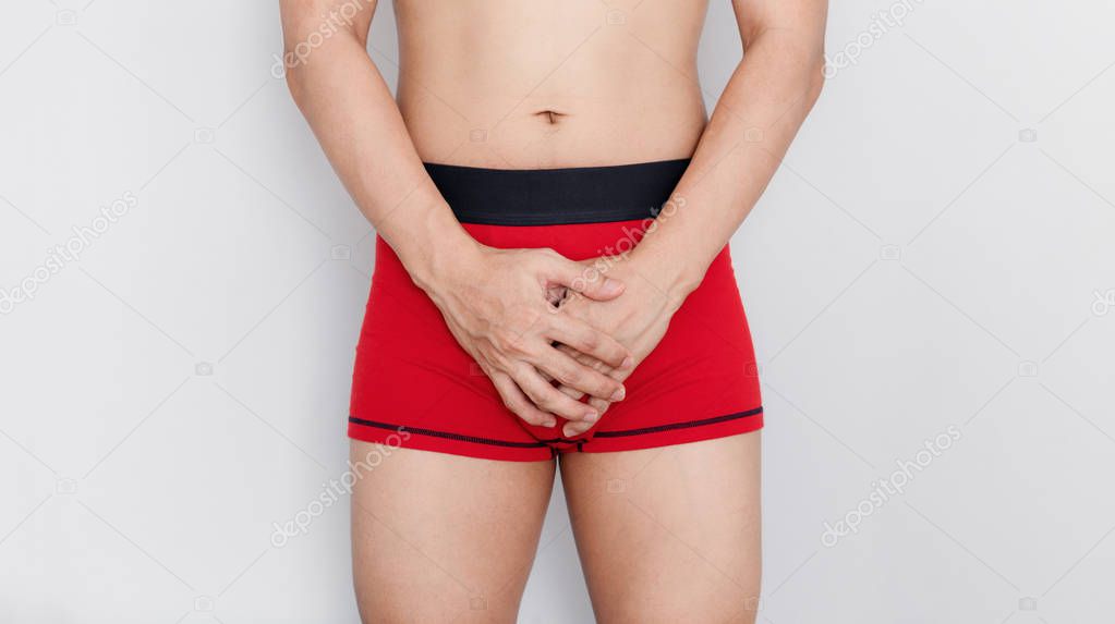Close-up a man in red underwear. Men health sexual dysfunction problem