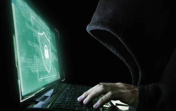 Digital data security system and protection. Anonymous hacker try to hacking on computer laptop