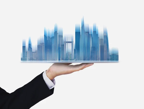 Businessman holding futuristic smart buildings hologram, on white background
