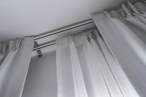 Two layers curtain with rails, installed on ceiling, translucent and blocking lights curtains