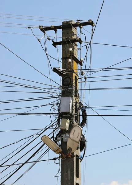 stock image Chaos of cables and wires on an electric pole, Romania