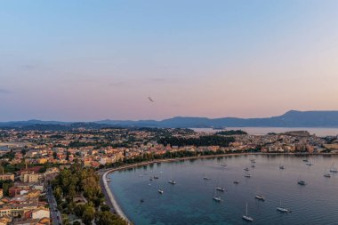 Panoramic View of Corfu Town at Twilight with Old Fortress and Garitsa Bay