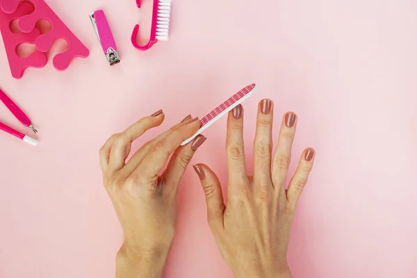 Female Hands Using Nailfile Nails Top View — Stock Photo, Image