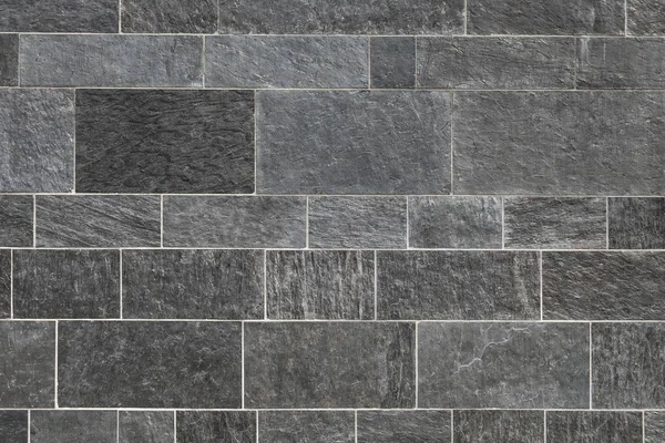Siyah taş duvar arka plan, harç ile kaldırım kaliteli gri taş ışık