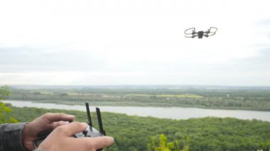 Man controlling a quadrocopter drone