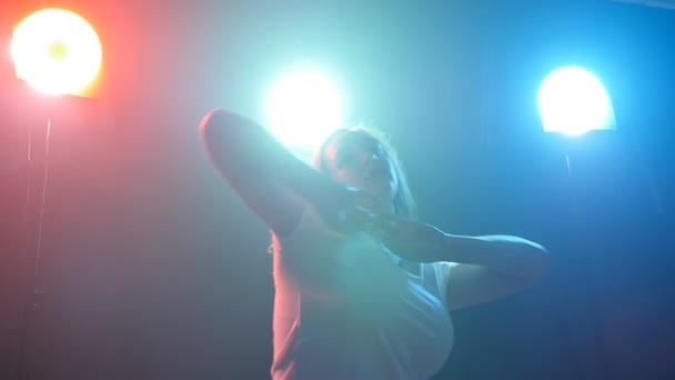 Young girl dancing in color light — Stock Video