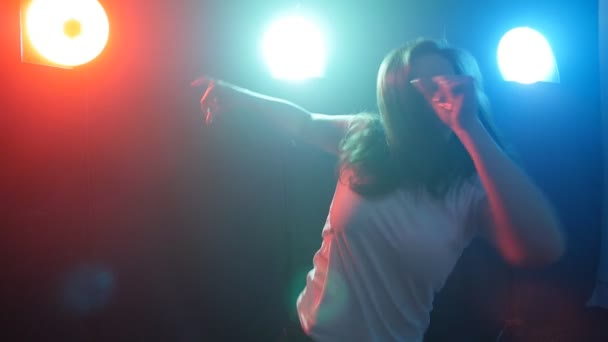 Young girl dancing in color light — Stock Video