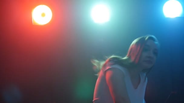 Young girl dancing in color light — Stock Video