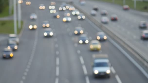 Cars drive along the highway. Defocus shot — Stock Video