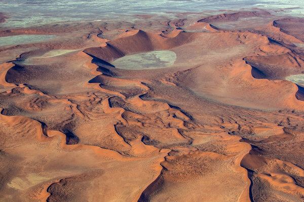 Aerial view of sand dunes of Sossusvlei in Namib-Naukluft National Park, Africa. 