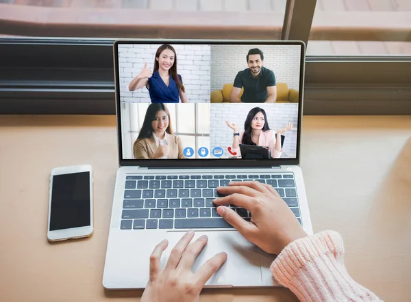 Woman video conference with team on laptop,have online briefing or consultation from home,Business team using laptop for speak talk on group in video call. Group of people working from home