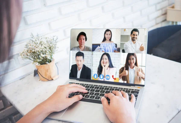Woman video conference with team on laptop,have online briefing or consultation from home,Business team using laptop for speak talk on group in video call. Group of people working from home