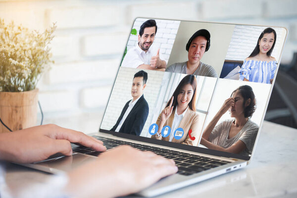 Woman video conference with team on laptop,have online briefing or consultation from home,Business team using laptop for speak talk on group in video call. Group of people working from home