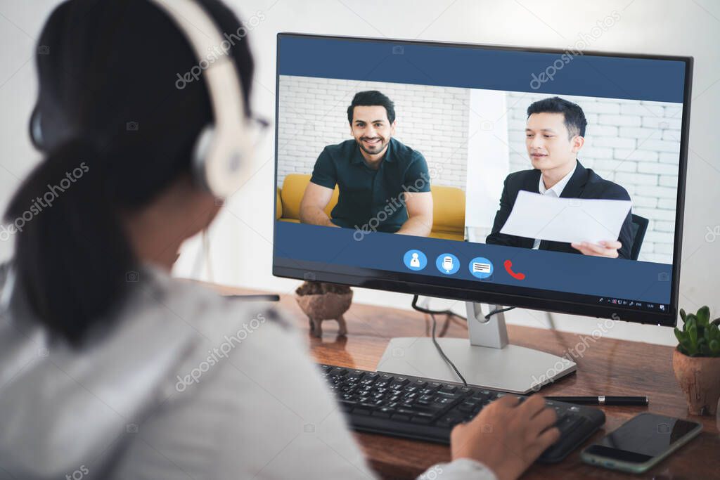 Woman video conference with team on laptop,have online briefing or consultation from home,Business team using laptop for speak talk on group in video call. Group of people working from home