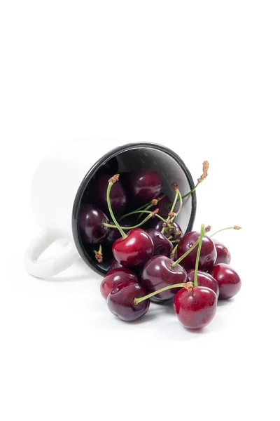 White cup with red sweet cherry isolated on a white background — Stock Photo, Image