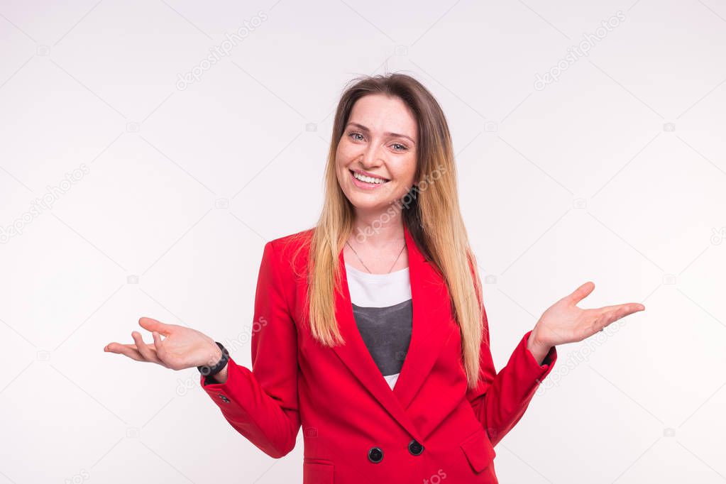 Laughing blond hair young woman in a red jacket with opened pose.