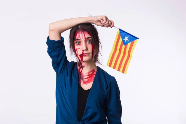 Portrait young catalan victim woman holding flag of catalonia isolated on white background. Protest against terrorism.