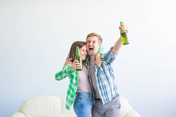 Soccer world cup concept - Young friends drink beer and cheering for football