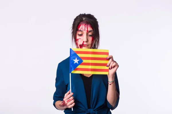 Portrait young catalan victim woman holding flag of catalonia isolated on white background. Protest against terrorism.